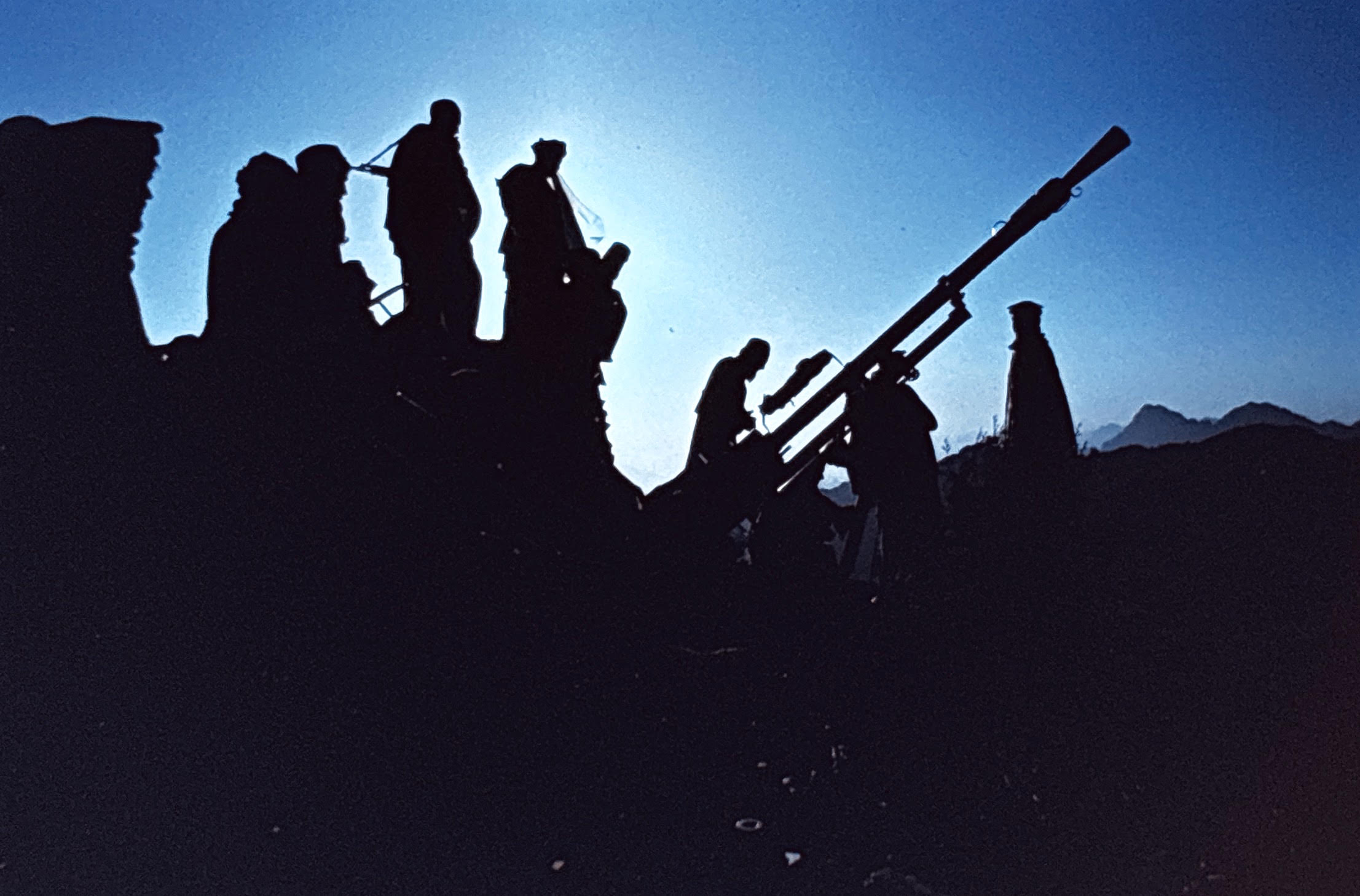 Anti-aircraft gun crew at dusk, Afghanistan